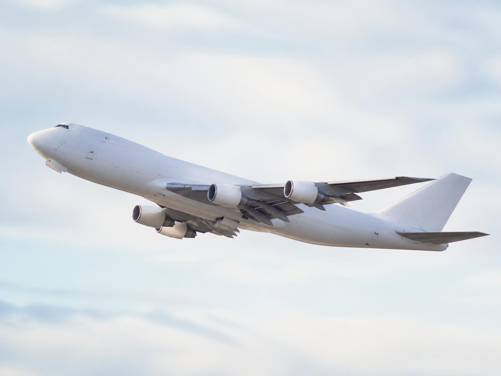 Cargo freighter aircraft climbing after departure